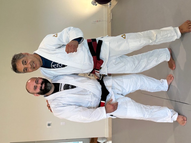 1st Degree from Chris Burns. I owe a lot ot Chris. He helped me refine all of my technique, and showed me details I was missing.  He helped me understand the concepts and principles behind Rickson's Jiu Jitsu, and also how Rickson's Jiu Jitsu has evolved from when he ran an academy with Henry Akins to now. Chris gave me hours upon hours of instruction and fine tuning.  He tested me for my 1st degree over the course of 3 years, and for the final stage of the test, I went with him on tour and was tested for 2.5 weeks straight, including being tested at Rickson's house.  I am honored and humbled to be ranked under Chris, and am forever grateful.  I look forward to continuing to learn from Chris and respresent him. It is an honor to be part of this journey. - Photo 5