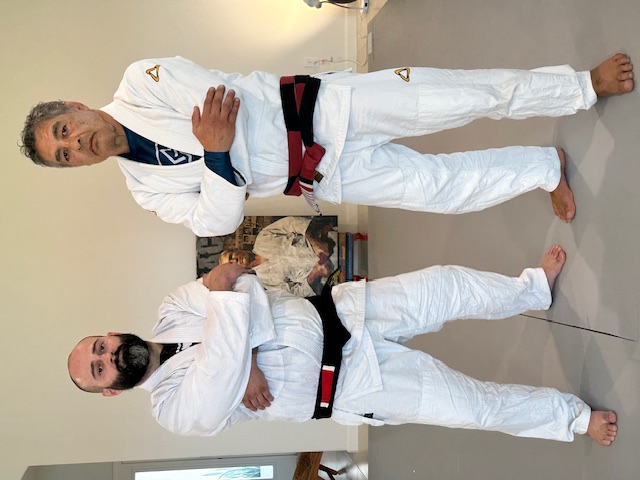 1st Degree from Chris Burns. I owe a lot ot Chris. He helped me refine all of my technique, and showed me details I was missing.  He helped me understand the concepts and principles behind Rickson's Jiu Jitsu, and also how Rickson's Jiu Jitsu has evolved from when he ran an academy with Henry Akins to now. Chris gave me hours upon hours of instruction and fine tuning.  He tested me for my 1st degree over the course of 3 years, and for the final stage of the test, I went with him on tour and was tested for 2.5 weeks straight, including being tested at Rickson's house.  I am honored and humbled to be ranked under Chris, and am forever grateful.  I look forward to continuing to learn from Chris and respresent him. It is an honor to be part of this journey. - Photo 6